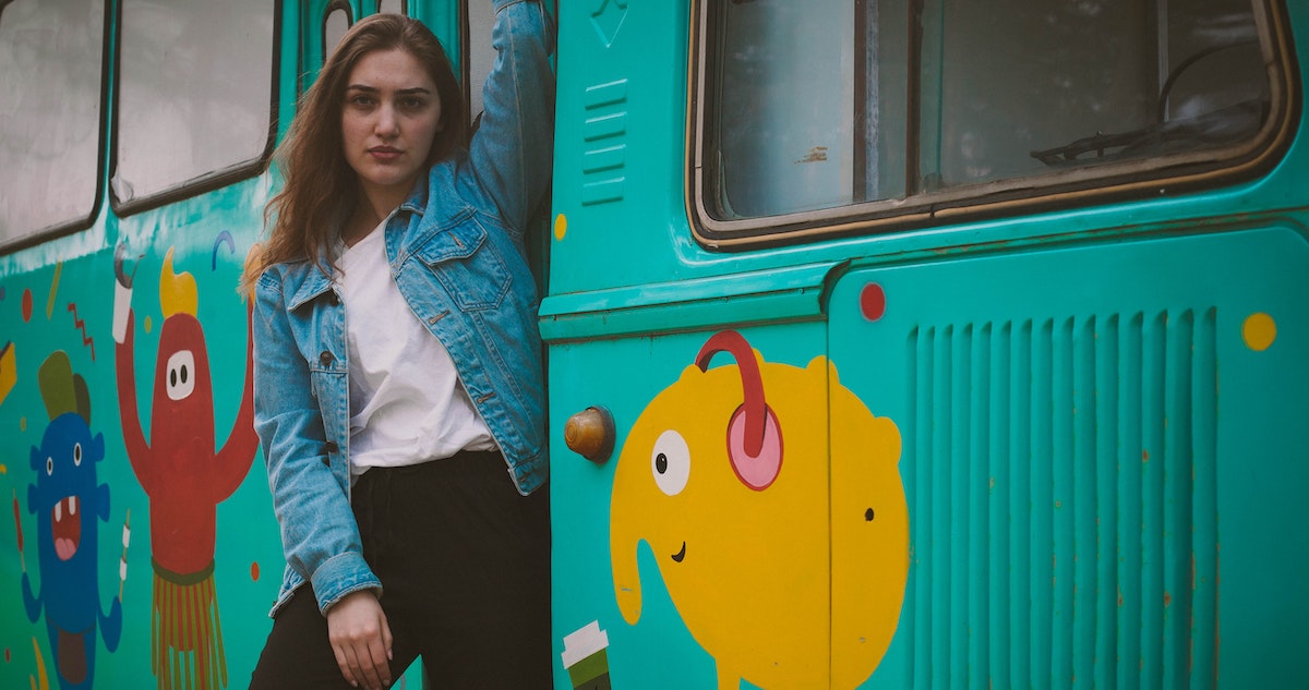 Animation project: image of woman on a train with animated characters painted on the side