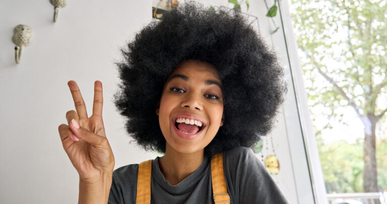 Webcam view of influencer beauty blogger speaking online with followers