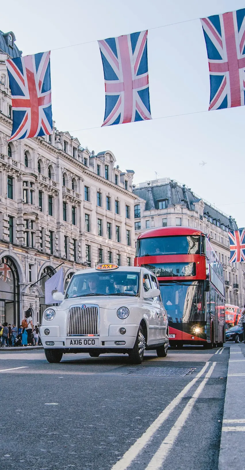 An awesome voice accent for your VO projects: Image of British flags hanging across a street in London