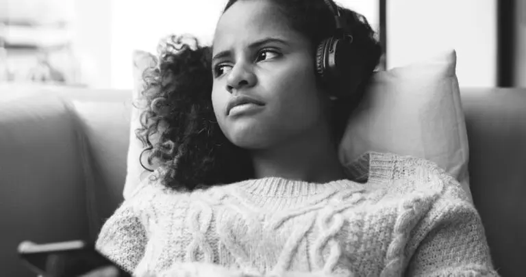 Woman listening to music with headphones on